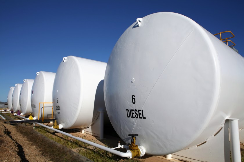 Enormous white diesel fuel tanks lined up in Houston, Texas